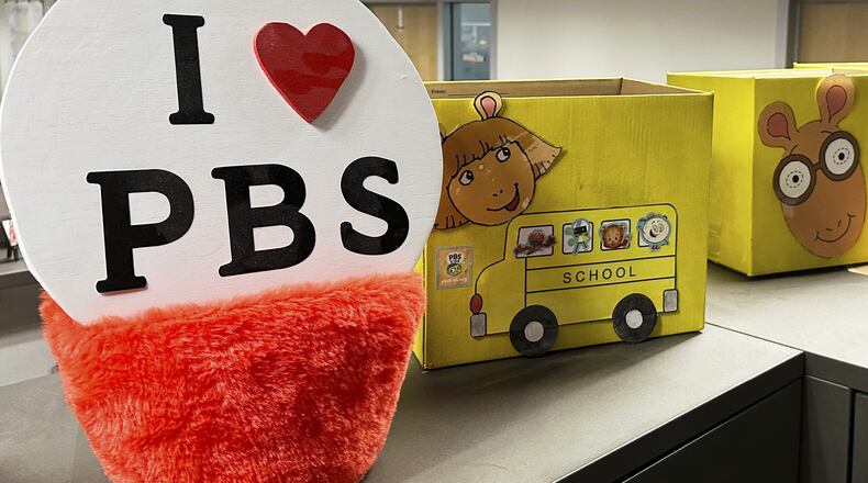 FILE - PBS Kids show characters including the title character from "Arthur" decorate boxes at the Arizona PBS offices in the Walter Cronkite School of Journalism and Mass Communication in Phoenix, May 2, 2025. (AP Photo/Katie Oyan, File)