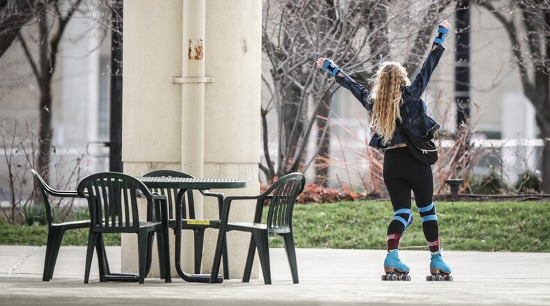 Olivia Bowman, from Dayton, skates around Riverscape in the sun Monday afternoon. Bowman said skating is her COVID-19 strategy.