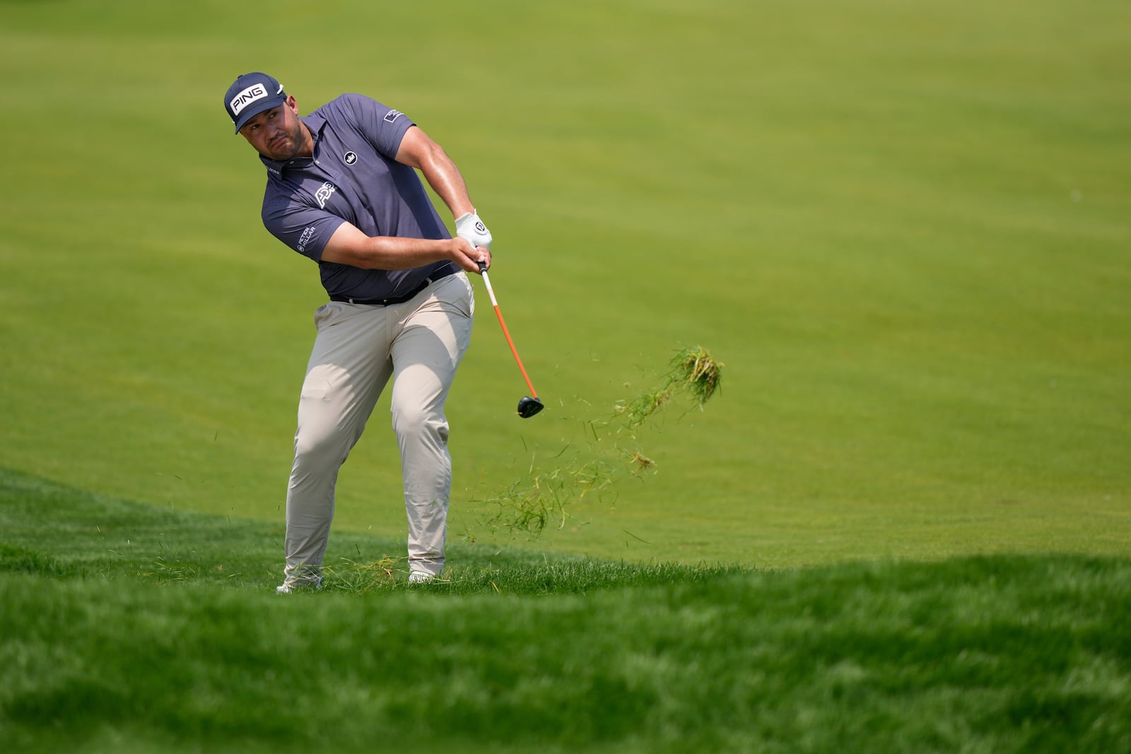 Thriston Lawrence, of South Africa, hits from the 18th fairway during the first round of the U.S. Open golf tournament at Oakmont Country Club Thursday, June 12, 2025, in Oakmont, Pa. (AP Photo/Charlie Riedel)