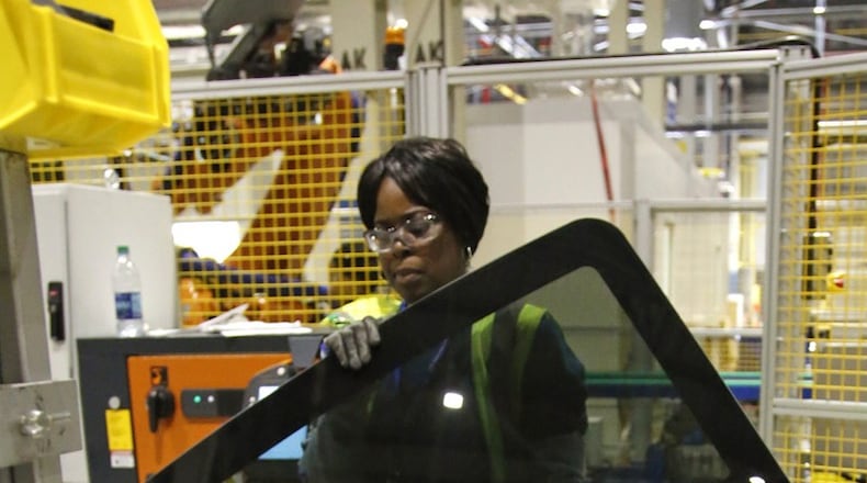 A worker at Fuyao Glass America in Moraine. TY GREENLEES/STAFF