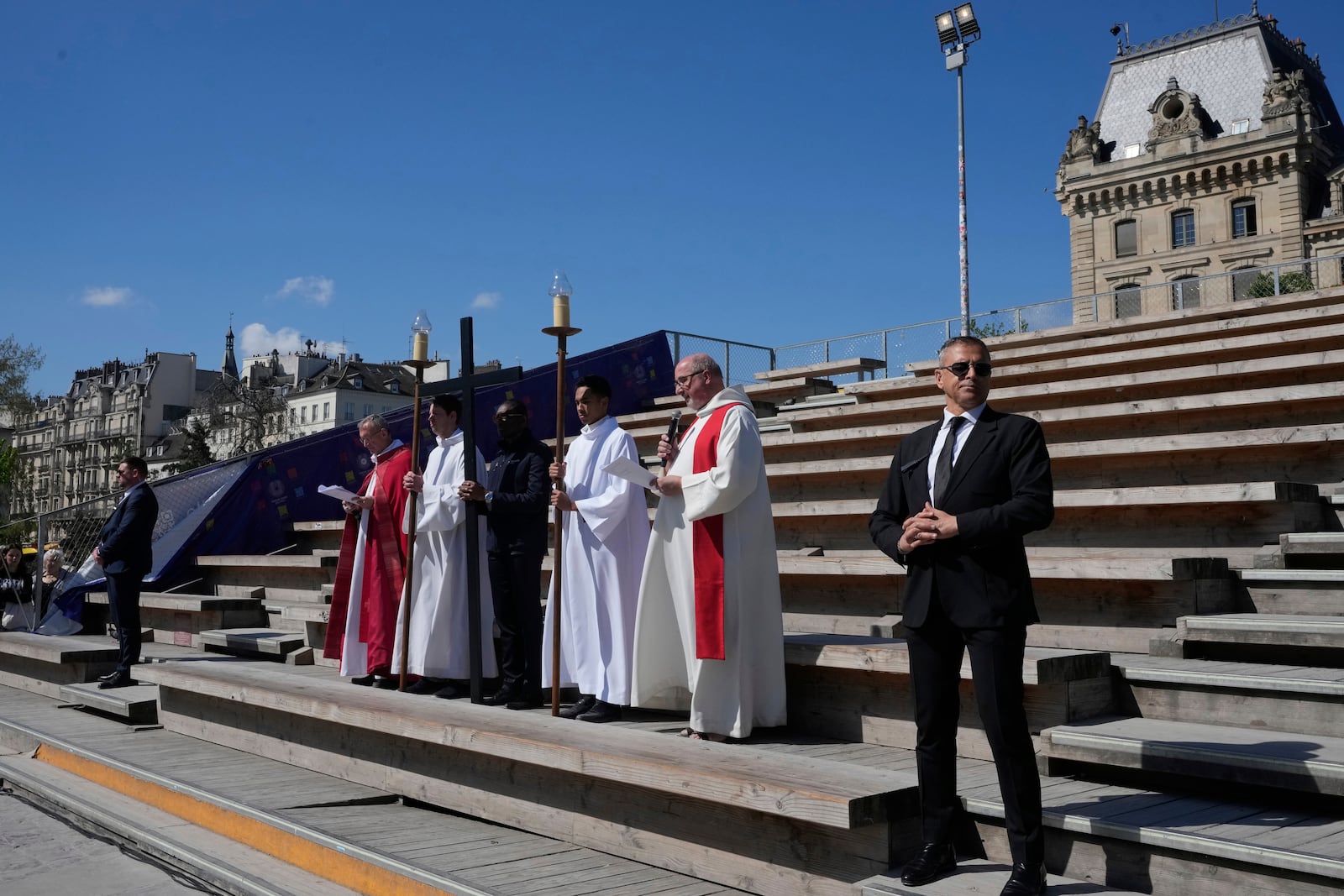 Clergymen stop during the Way of Cross ceremony to mark Good Friday at Notre Dame cathedral, Friday, April 18, 2025 in Paris. (AP Photo/Michel Euler)