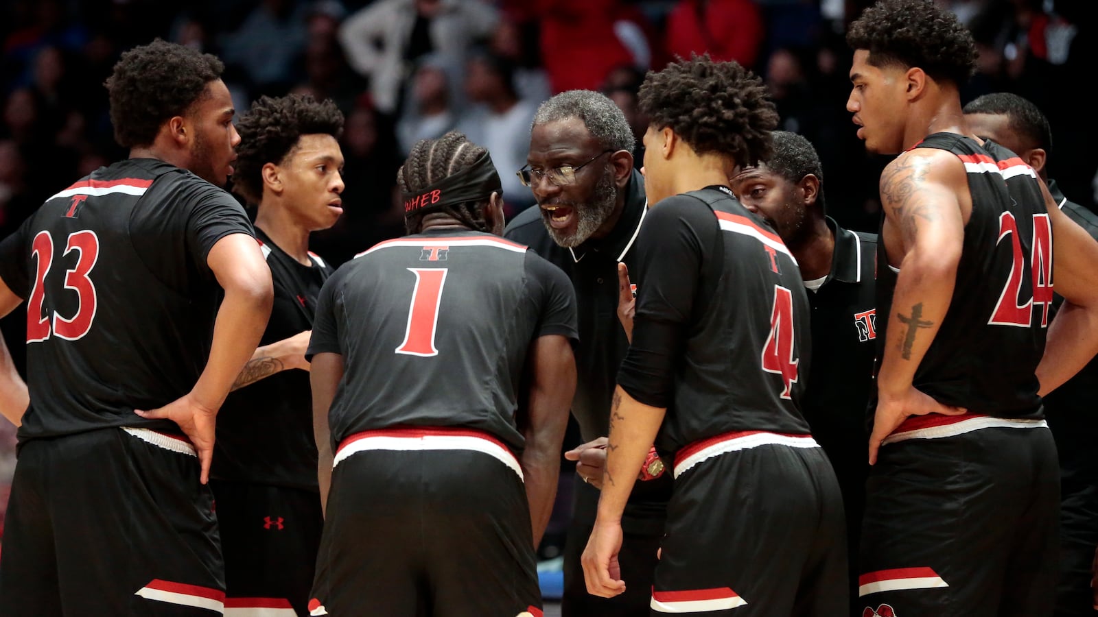 Trotwood head coach Carl Blanton Sr. talks to his team on the floor during a Division III state semifinal game on Thursday, March 19, 2026, at UD Arena. Trotwood won 55-53. STEVEN WRIGHT / STAFF