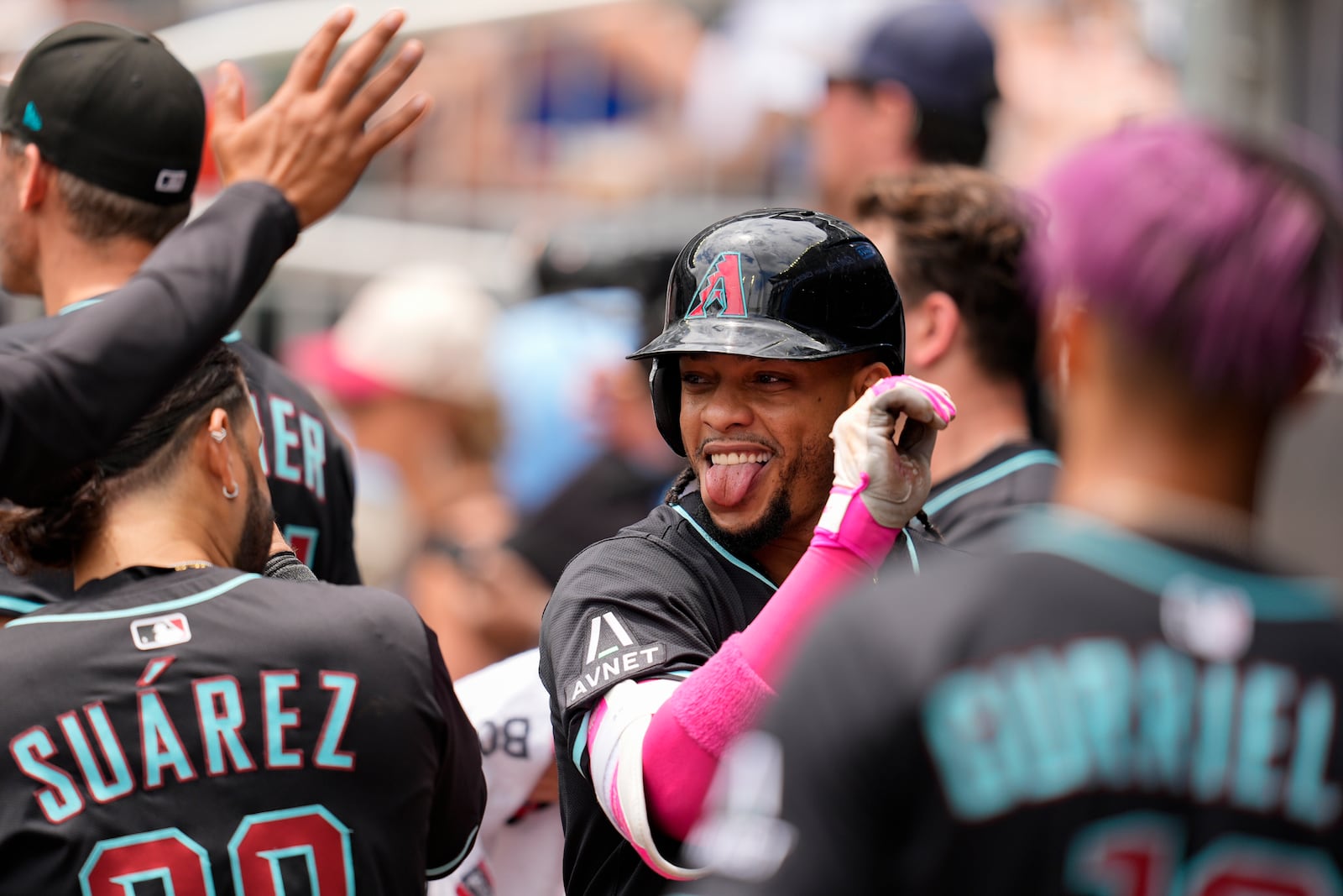 Arizona Diamondbacks second baseman Ketel Marte (4) celebrates his solo homer against the Atlanta Braves in the eighth inning of a baseball game, Thursday, June 5, 2025, in Atlanta. (AP Photo/Mike Stewart)