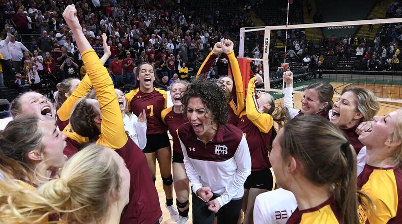 New Bremen celebrates its Division IV state volleyball title Saturday night at Wright State’s Nutter Center. Nick Falzerano/CONTRIBUTED