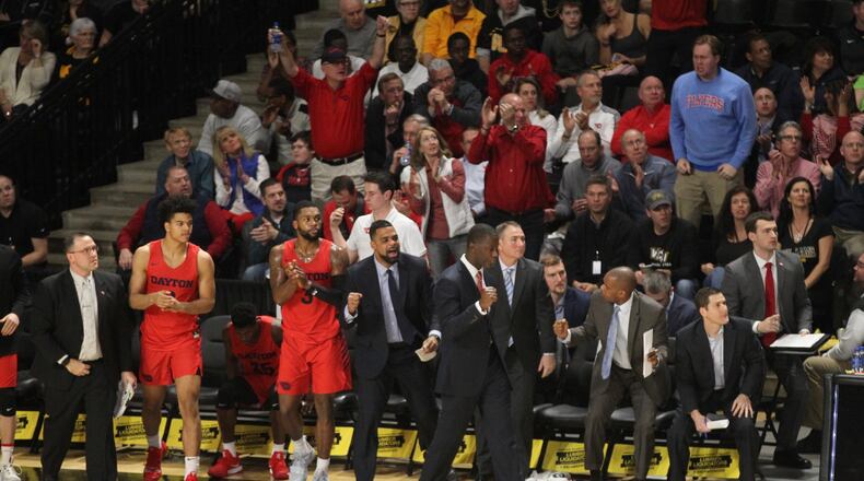 The Dayton bench reacts to a score during a game against Virginia Commonwealth on Wednesday, Jan. 19, 2019, at the Siegel Center in Richmond, Va. David Jablonski/Staff