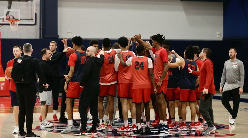 Dayton huddles before practice at the Entertainment and Sports Arena in Washington, D.C., on Thursday, March 10, 2022, one day before playing in the quarterfinals of the Atlantic 10 Conference tournament. David Jablonski/Staff