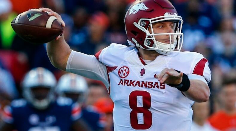In this Oct. 22, 2016, file photo, Arkansas quarterback Austin Allen (8) throws a pass against Auburn during the first half of an NCAA college football game, in Auburn, Ala. After a successful first season as the starting quarterback at Arkansas for Austin Allen, the senior enters this season with a resume equal to nearly any other signal caller in the country. Both he and Razorbacks coach Bret Bielema know, however, that the national recognition isn't likely to come until Arkansas starts winning more games. (AP Photo/Butch Dill, File)