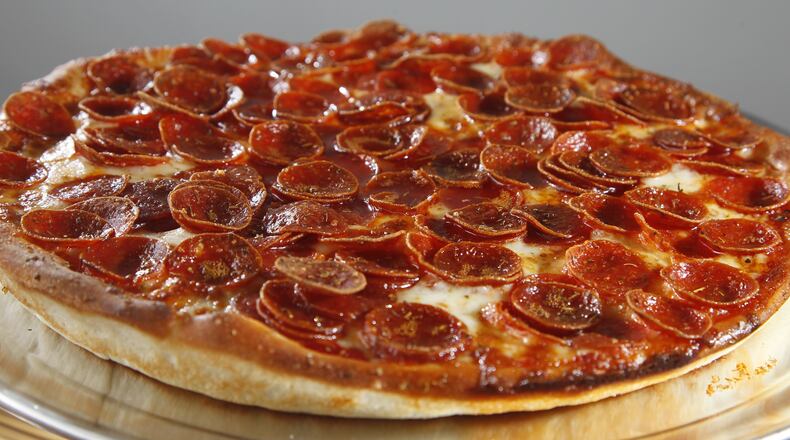 Gionino's Pizzeria opened its first Dayton location at 1528 E. Third St. The franchise, owned by Tony Clark, has about 45 locations between Cleveland and Canton, with a Columbus location as well. LISA POWELL / STAFF