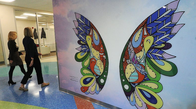 The new five-story 152,000-square-foot specialty care outpatient center at Dayton Children's Hospital started seeing patients in March. As Dayton Children's continues to expand its main campus, the hospital recently announced a partnership for a West Dayton facility that will include a pediatric clinic and a market, the latter being headed up by Sunlight Village. MARSHALL GORBY\STAFF FILE