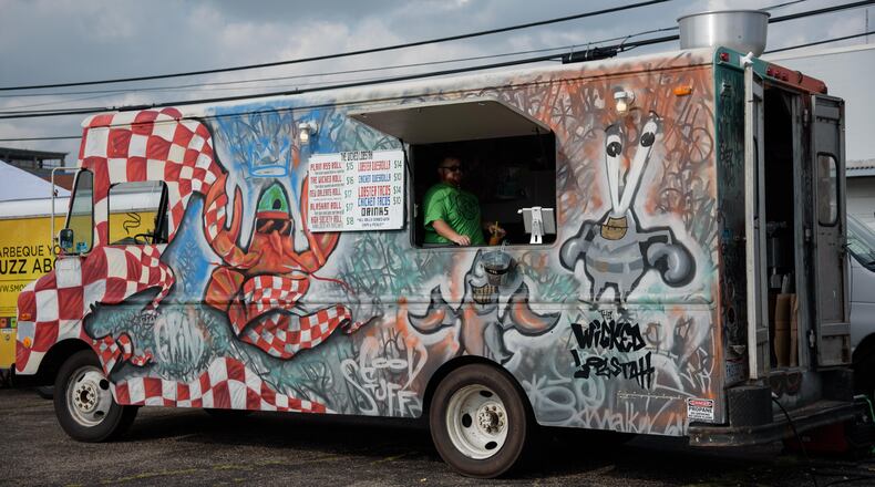 The Yellow Cab hosted another one of its monthly food truck rallies on Friday, July 19. Street food, live music and shopping at The Night Market are part of the fun. This month the trucks that attended were El Meson, Smokinbeebeeq, Greek Street Food Truck, The Wicked Lobstah, EAT, Cupzilla-Korean BBQ, Thai1On, Bella Sorella Pizza, Cheezy Creationz
and Billie Gold Bubble Tea. TOM GILLIAM / CONTRIBUTING PHOTOGRAPHER