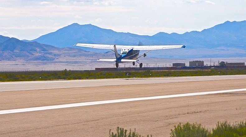 A ROBOpilot controlled 1968 Cessna 206 takes off during its first flight at Dugway Proving Ground, Utah. (Courtesy photo)