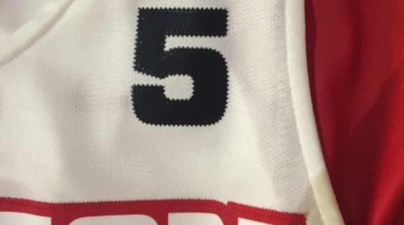 The No. 5 honoring Steve McElvene on Dayton’s uniforms.
