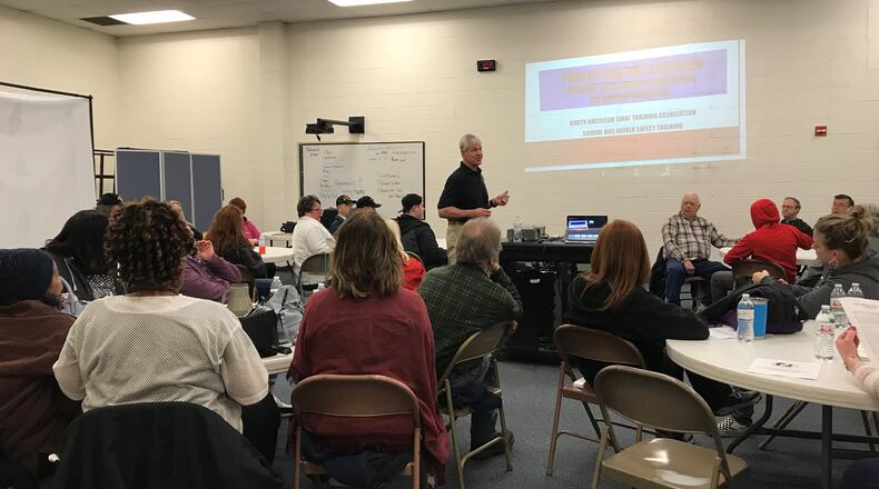 James Scanlon, co-owner of North American SWAT Training Association trains Fairborn City School’s bus drivers. Kayla Courvell/Staff