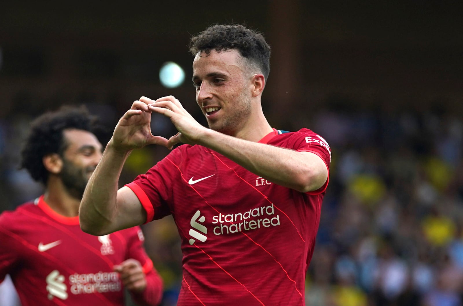 FILE - Liverpool's Diogo Jota celebrates scoring during the Premier League match at Carrow Road, Norwich, Saturday Aug. 14, 2021. (Joe Giddens/PA via AP, File)