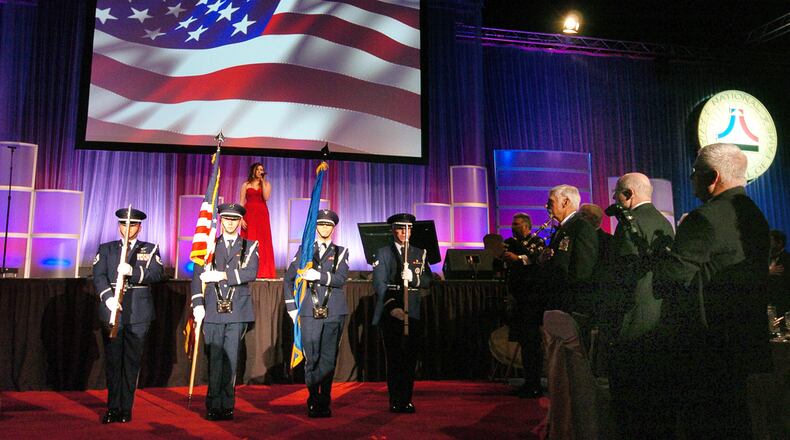 Rebecca McGown sings the National Anthem at during the opening ceremonies at the National Aviation Hall of Fame 50th anniversary dinner and ceremony Saturday evening at the Dayton Convention Center Contributed Photo by Charles Caperton