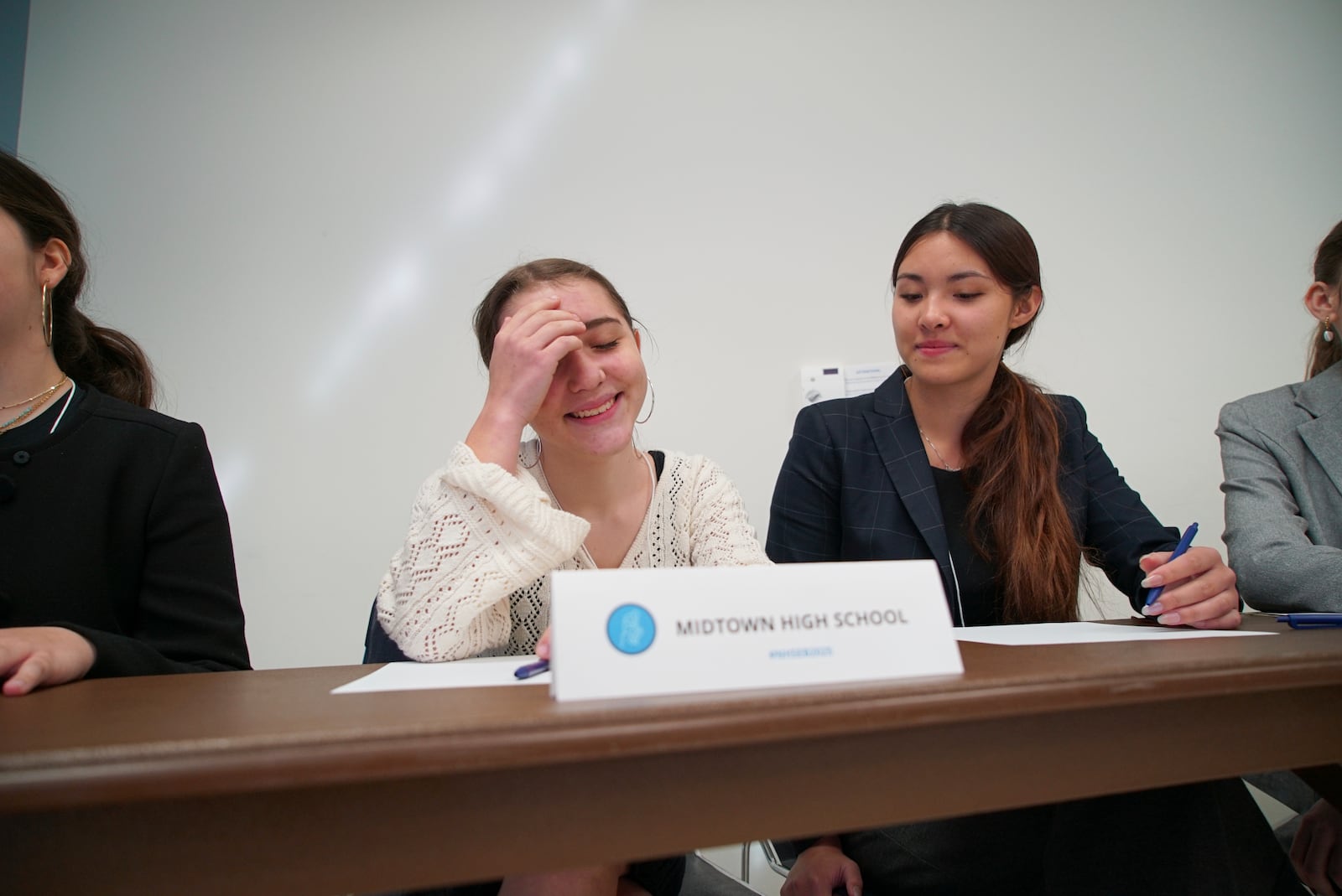 Midtown High School Ethics Bowl teammates Lizzie Lyman, left, and Sloane Crisler prepare for the quarterfinal round at the National High School Ethics Bowl in Chapel Hill, N.C., on Sunday, April 13, 2025. (AP Photo/Allen G. Breed)