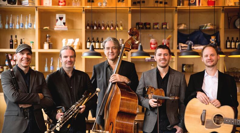 The Vic 150 Series presents Irish group Lúnasa, (left to right) Kevin Crawford, Cillian Vallely, Trevor Hutchinson, Seán Smyth and Ed Boyd, at Victoria Theatre in Dayton on Thursday, March 14. CONTRIBUTED