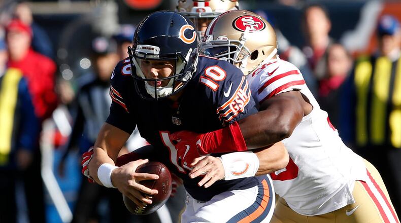 CHICAGO, IL - DECEMBER 03: Quarterback Mitchell Trubisky #10 of the Chicago Bears is sacked by Elvis Dumervil #58 of the San Francisco 49ers in the first quarter at Soldier Field on December 3, 2017 in Chicago, Illinois. The San Francisco 49ers defeated the Chicago Bears 15-14. (Photo by Kena Krutsinger/Getty Images)