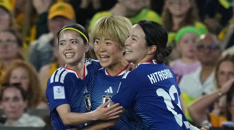 Japan's Maika Hamano, center, celebrates after scoring the first goal during the Women's Asian Cup soccer final between Japan and Australia in Sydney, Saturday, March 21, 2026. (AP Photo/Mark Baker)