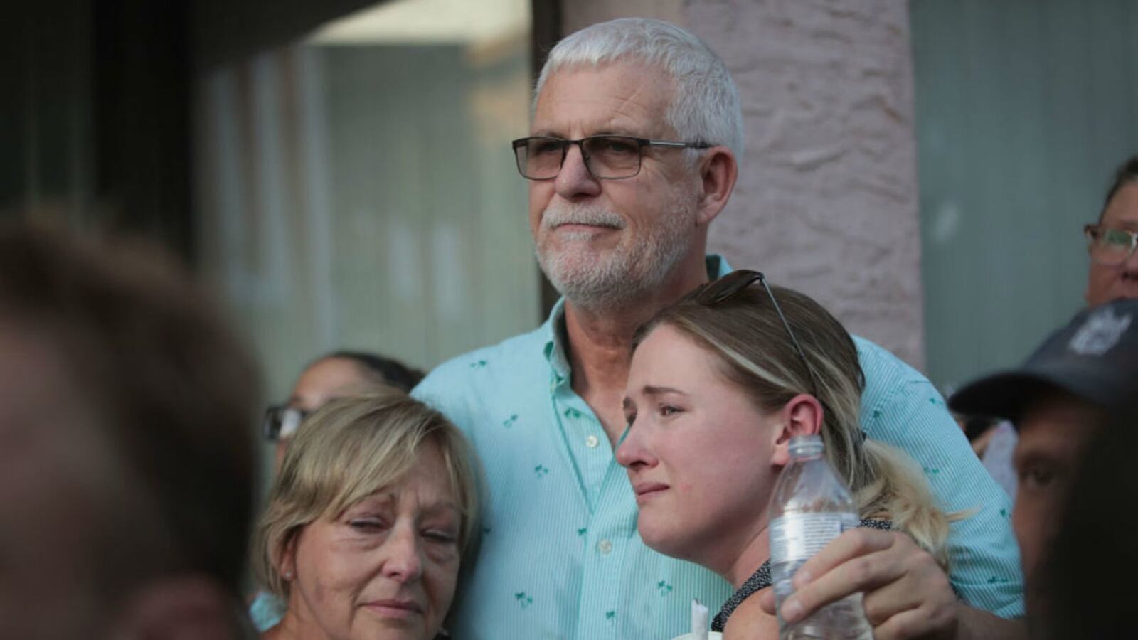 Mike Turner began hugging others after his son, Logan Turner, was one of the nine people killed Aug. 4 in Dayton, Ohio. SCOTT OLSON/GETTY IMAGES