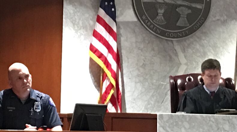 Springboro Officer Jeff Strader was grilled by the lawyer representing a teacher charged in a drug case also implicating her son. LAWRENCE BUDD/STAFF