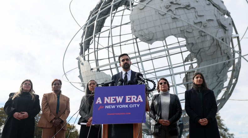 New York City mayor-elect Zohran Mamdani, center, speaks in front of the Unisphere alongside his transition team, from left, Elana Leopold, Melanie Hartzog, Maria Torres-Springer, Grace Bonilla, and Lina Khan, in the Queens borough of New York, Wednesday, Nov. 5, 2025. (AP Photo/Heather Khalifa)