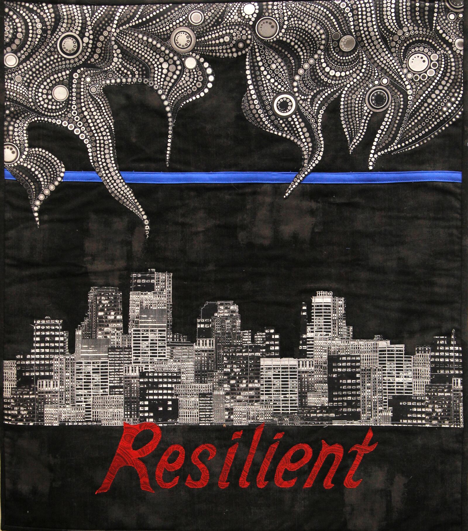 "Dayton Strong, A Quilt Show" is on display at the Woodbourne Library in Centerville through Dec. 2. The exhibition is a response to the May Ku Klux Klan rally in Dayton, the Memorial Day tornadoes and the Oregon District shootings. LISA POWELL / STAFF