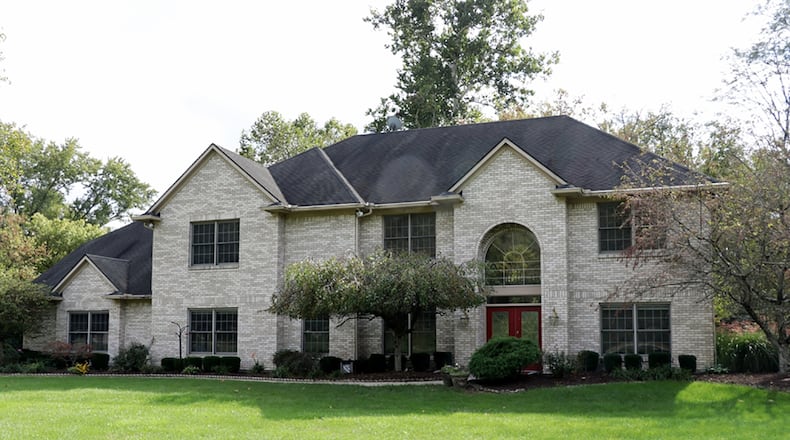 The home, which offers 5 or 6 bedrooms, has about 5,390 sq. ft. of living space. A long driveway curves off the shared drive to the 4-car garage. Many updates have been made during the past 2 years. CONTRIBUTED PHOTO BY KATHY TYLER