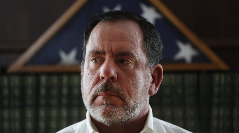 Ross Geiger poses for a photograph at his home, Saturday, Feb. 3, 2018, in Loveland, Ohio. Geiger, of suburban Cincinnati, voted for a death sentence 20 years ago and is now asking Ohio Gov. John Kasich to spare the condemned killer. He claims to have been compelled to follow the law when he voted in favor of execution for Raymond Tibbetts in 1997, saying now after reviewing documents presented at a hearing last year, he believes jurors didn’t know enough about Tibbetts’ rough childhood and abuse suffered in a foster home. (AP Photo/John Minchillo)