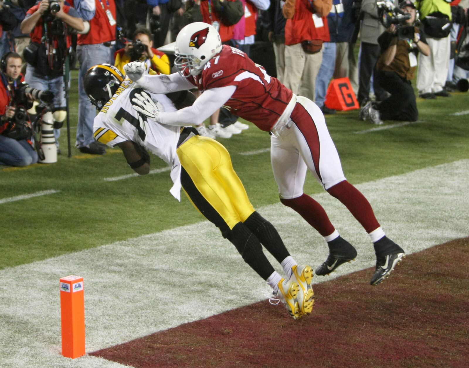 Pittsburgh Steelers wide receiver Santonio Holmes (10) catches a touchdown pass as Arizona Cardinals safety Aaron Francisco (47) defends during the fourth quarter of the NFL Super Bowl XLIII football game, Sunday, Feb. 1, 2009, in Tampa, Fla. (James Borchuck/Tampa Bay Times via AP, File)