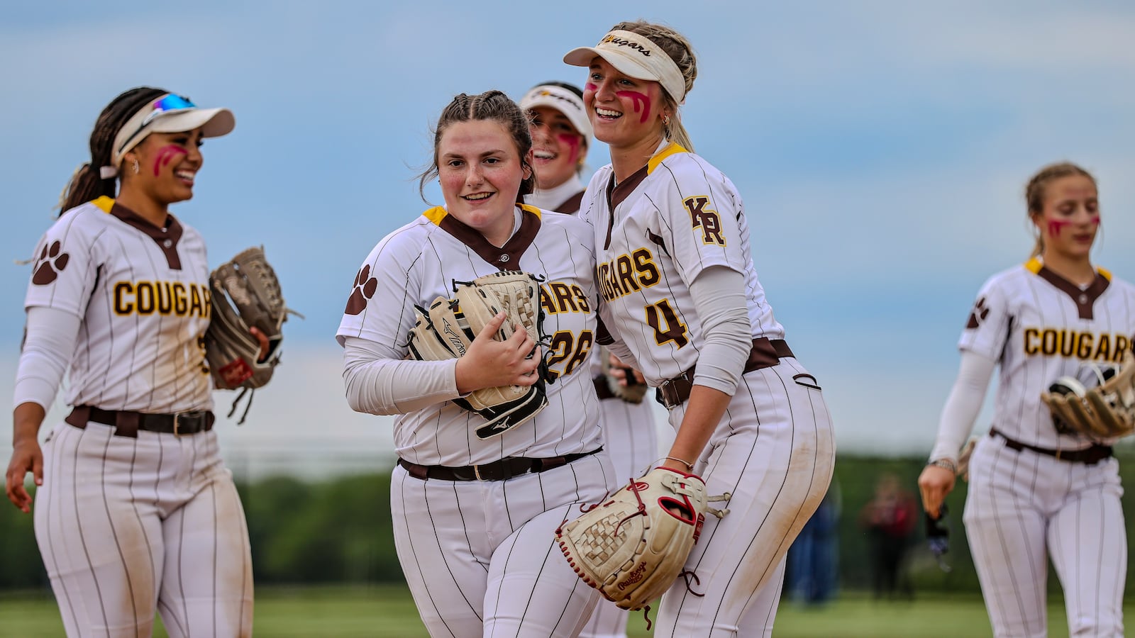 Kenton Ridge High School sophomore Jayden Davis hugs senior Kyanne Tyson after getting the last out during their Division IV district final game against CHCA on Friday, May 23 at Valley View High School. The Cougars won 11-0. MICHAEL COOPER / STAFF