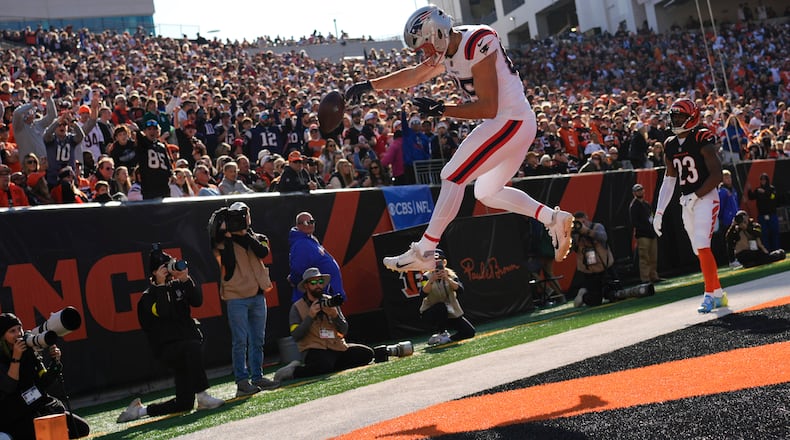 New England Patriots tight end Hunter Henry (85) celebrates after catching a touchdown pass during the first half of an NFL football game against the Cincinnati Bengals, Sunday, Nov. 23, 2025, in Cincinnati. (AP Photo/Carolyn Kaster)