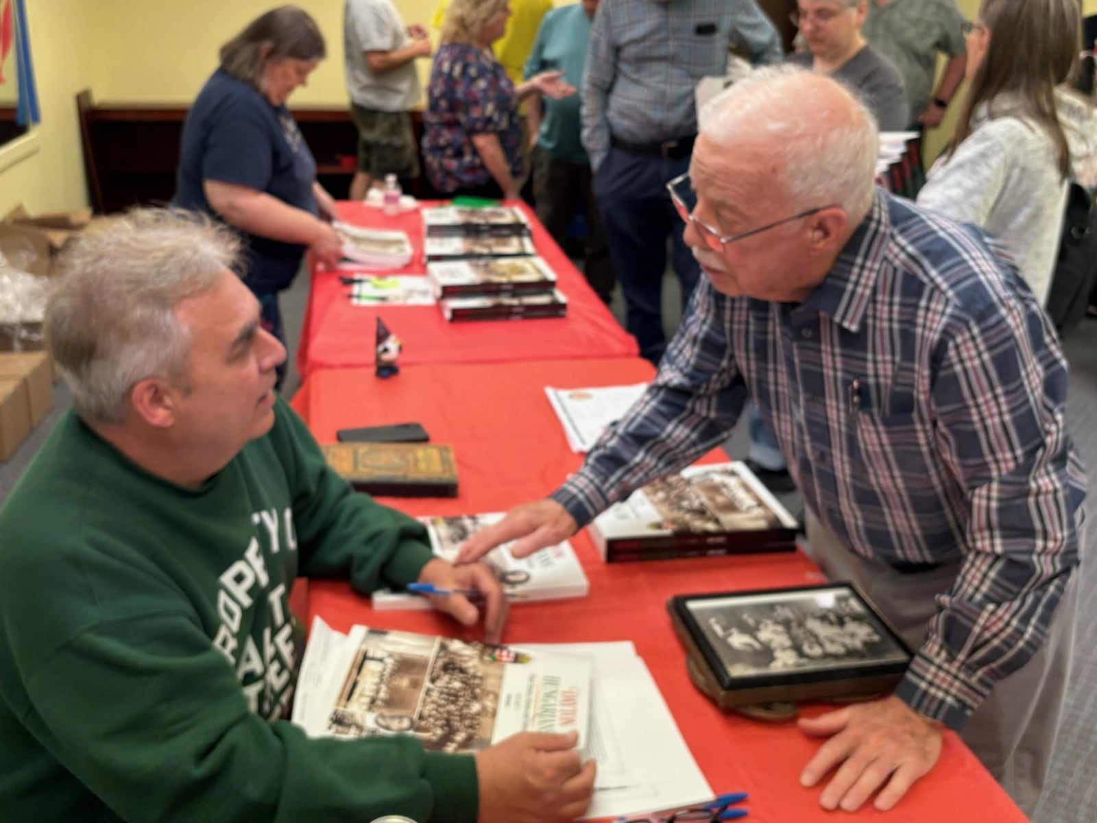 Mike Sakal talks to John Spirk during his book signing last Saturday at the New & Olde Pages Bookshop in Englewood. TOM ARCHDEACON / CONTRIBUTED PHOTO