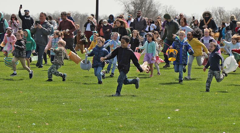 Hundreds of children participate in the annual Easter Egg Hunt at Young's Jersey Dairy north of Yellow Springs on Sunday, April 17, 2022. BILL LACKEY/STAFF