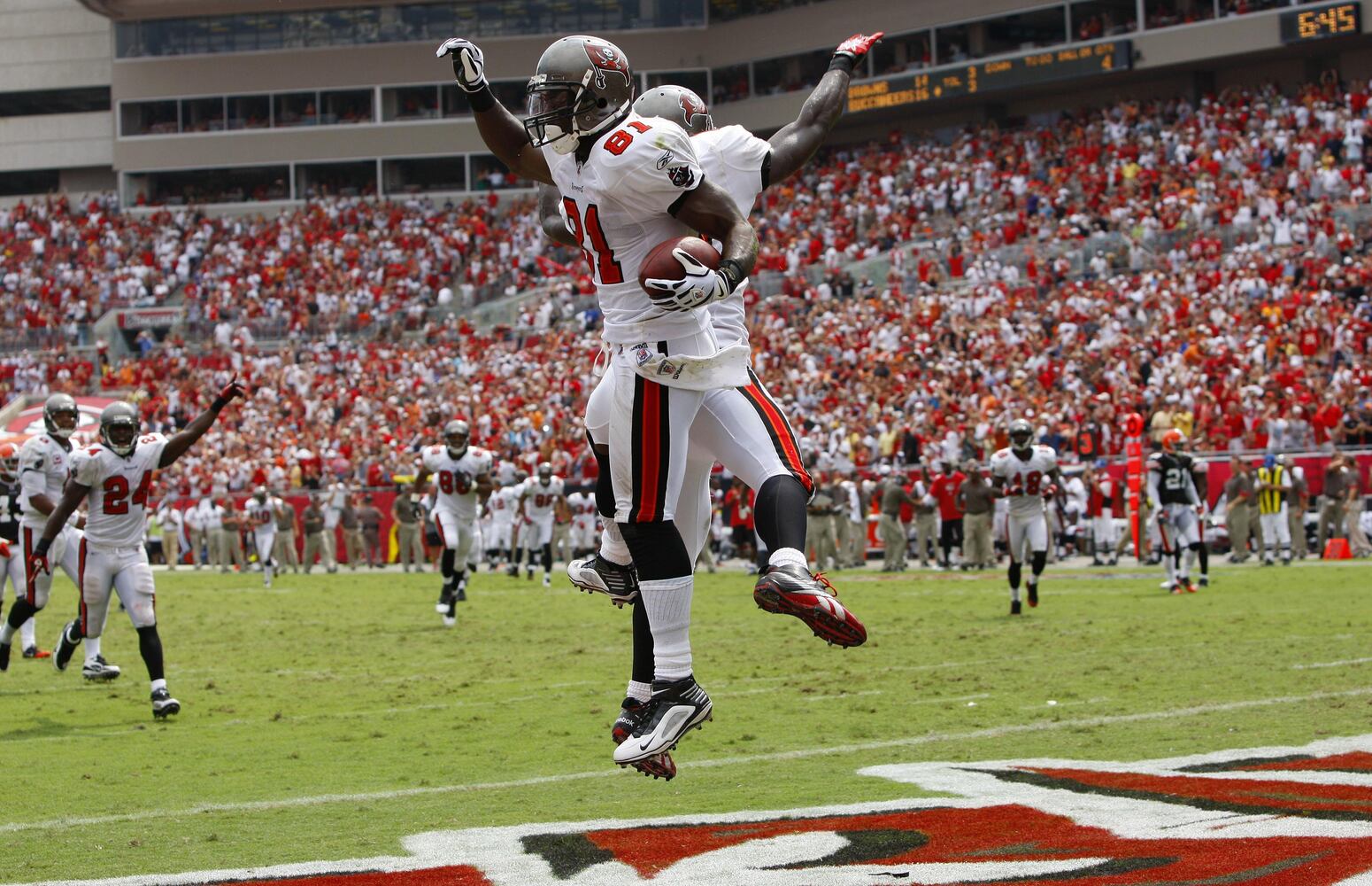 Buccaneers wide receiver Micheal Spurlock (81) celebrates after scoring a touchdown with wide receiver Mike Williams (19) during the second half.