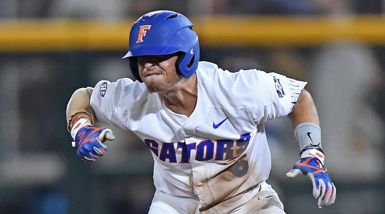 Florida third basemen Jonathan India reacts after hitting a double against LSU