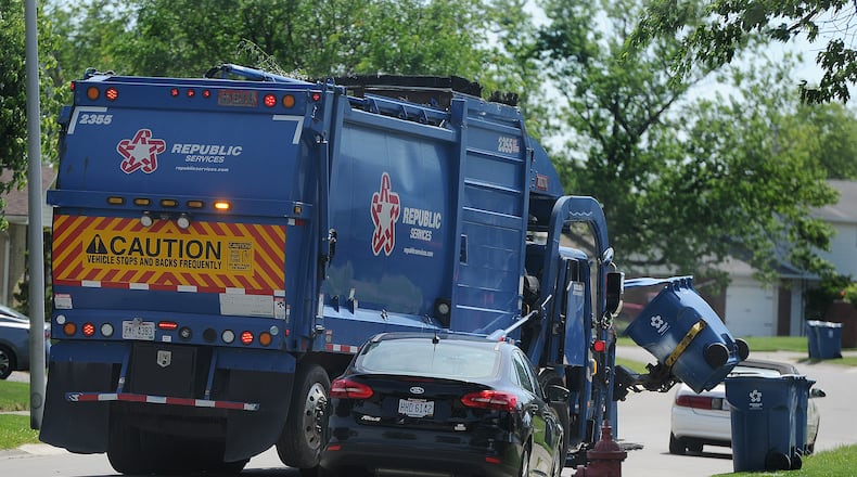 Trash pick-up in Huber Heights Thursday, June 24, 2021, by Republic Services. MARSHALL GORBY\STAFF