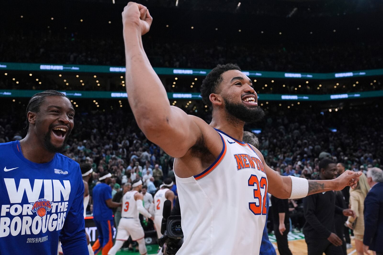 New York Knicks center Karl-Anthony Towns (32) celebrates after defeating the Boston Celtics in Game 2 of an NBA basketball second-round playoff series against the Boston Celtics, Wednesday, May 7, 2025, in Boston. (AP Photo/Charles Krupa)