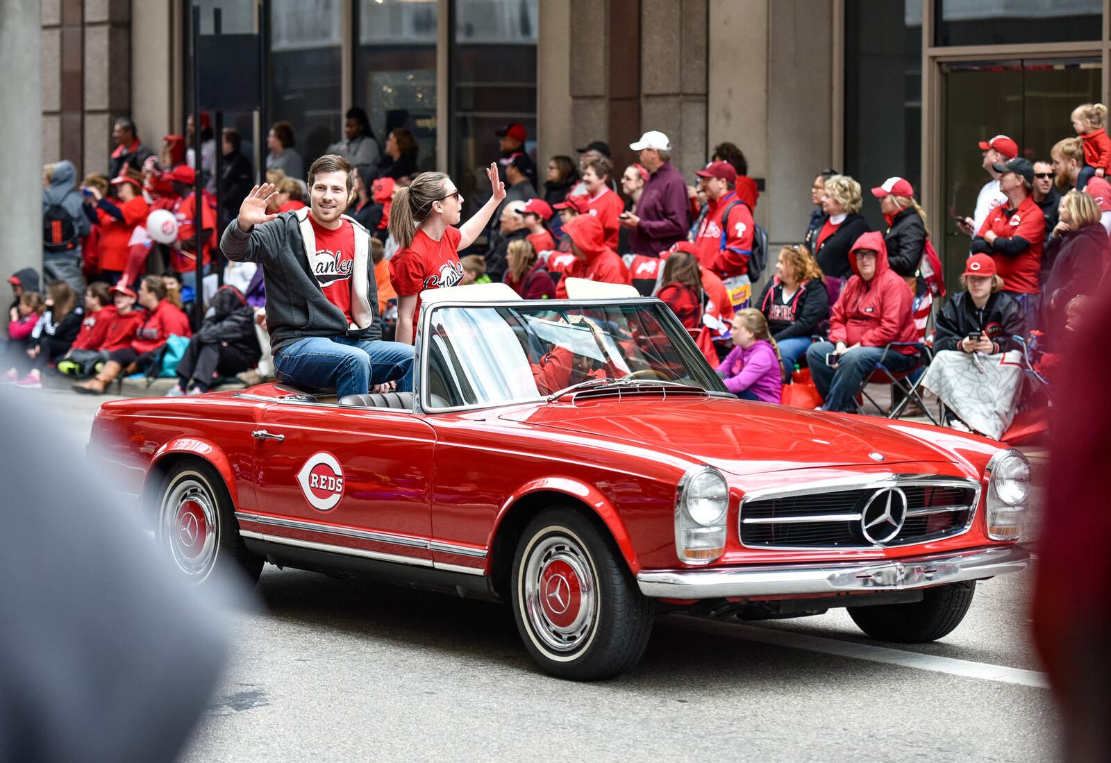 Thousands of fans lined the streets for the Reds Opening Day parade Monday, April 4 in Cincinnati. NICK GRAHAM/STAFF