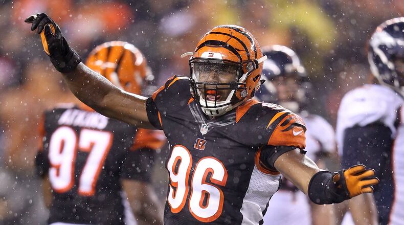 CINCINNATI, OH - DECEMBER 22: Carlos Dunlap #96 of the Cincinnati Bengals celebrates after sacking Peyton Manning #18 of the Denver Broncos during the fourth quarter at Paul Brown Stadium on December 22, 2014 in Cincinnati, Ohio. Cincinnati defeated Denver 37-28. (Photo by Andy Lyons/Getty Images)