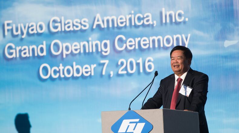 Cho Tak Wong, chairman of Fuyao Group, speaks during the grand opening of the Fuyao Glass America Moraine plant in October 2016. AP Photo/John Minchillo