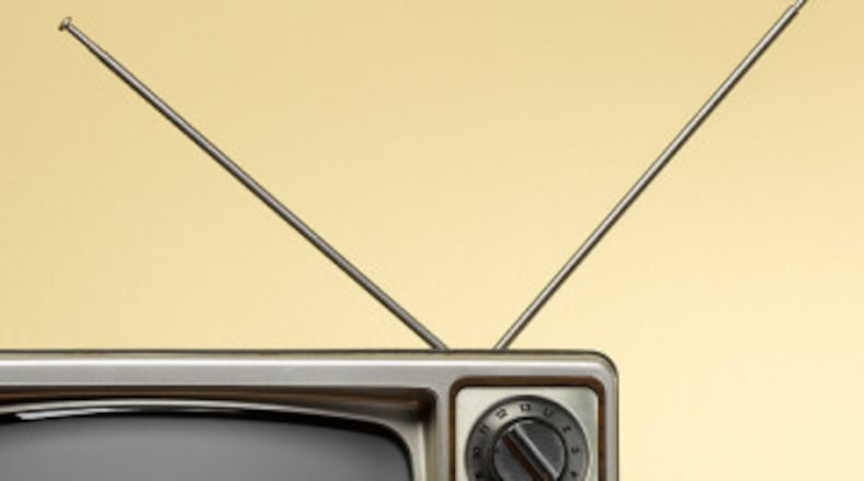 Rabbit ear antenna on an analog TV.