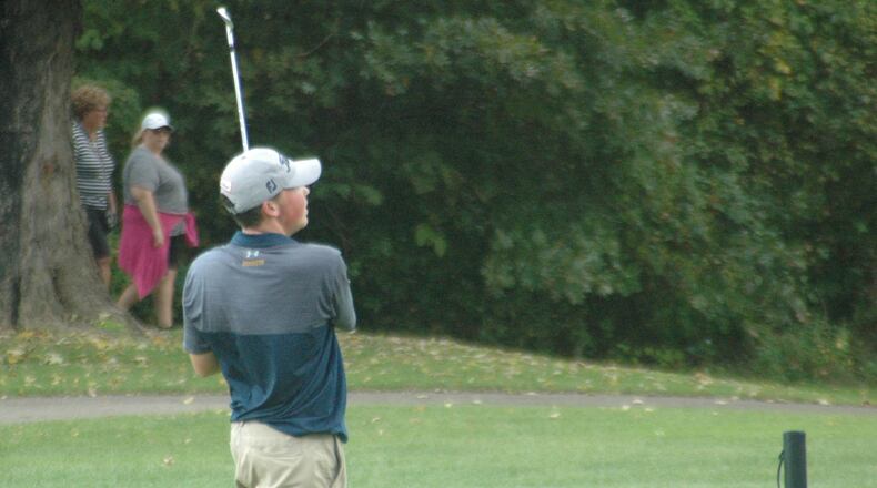 Monroe’s Alex Gomia watches one of his shots from the fairway during the 2018 Division I sectional boys golf tournament at Miami Whitewater Golf Course. RICK CASSANO/STAFF