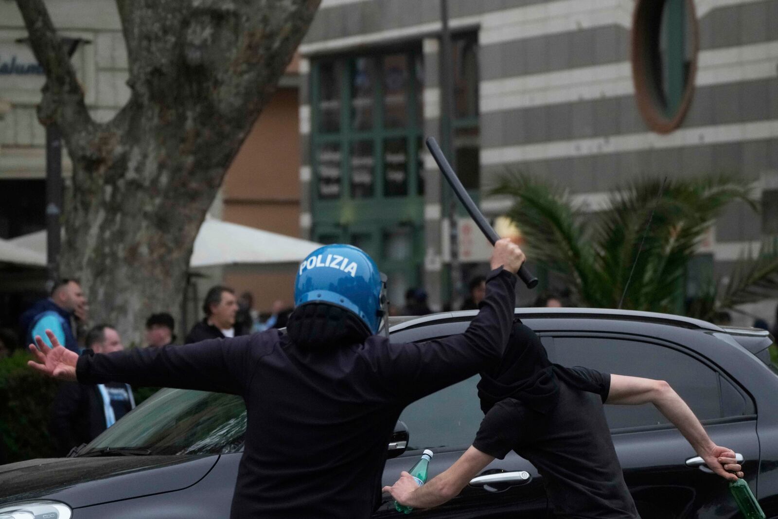 Lazio fans riot with Police ahead of the Italian Series A soccer match between Lazio and Roma outside Rome's Olympic stadium, Sunday, April 13, 2025. (AP Photo/Gregorio Borgia)