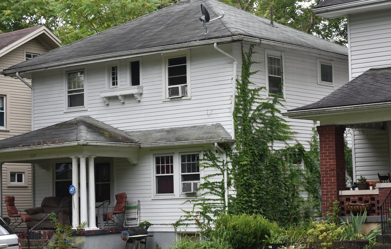 The city of Dayton issued a civil penalty warning to this home for alleged housing code violations. CORNELIUS FROLIK / STAFF