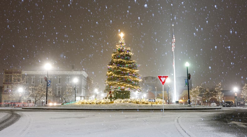 A snow storm moved through the region on Monday, Dec. 1 and blanketed area Christmas tree displays, including Troy. Miami County is expected to see between three and five inches; all of the area is expected to see at least two inches. BRYANT BILLING/STAFF
