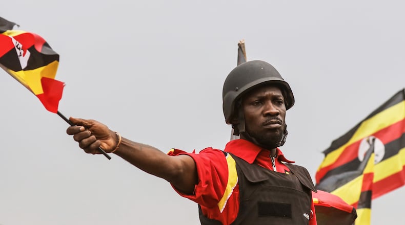 FILE - Uganda opposition presidential candidate Robert Kyagulanyi Ssentamu who is known as Bobi Wine waves to supporters at an election campaign rally in Mukono, Uganda, Friday, Jan. 9, 2026. (AP Photo/Hajarah Nalwadda, File)