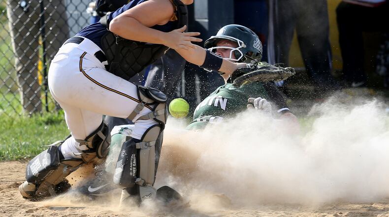Contributed photo by E.L. Hubbard Badin base runner Samantha Sander scores a run as Monroe catcher Sarah Eschmeyer can’t hand on to the throw during their game at Monroe Wednesday, Apr. 19, 2017.