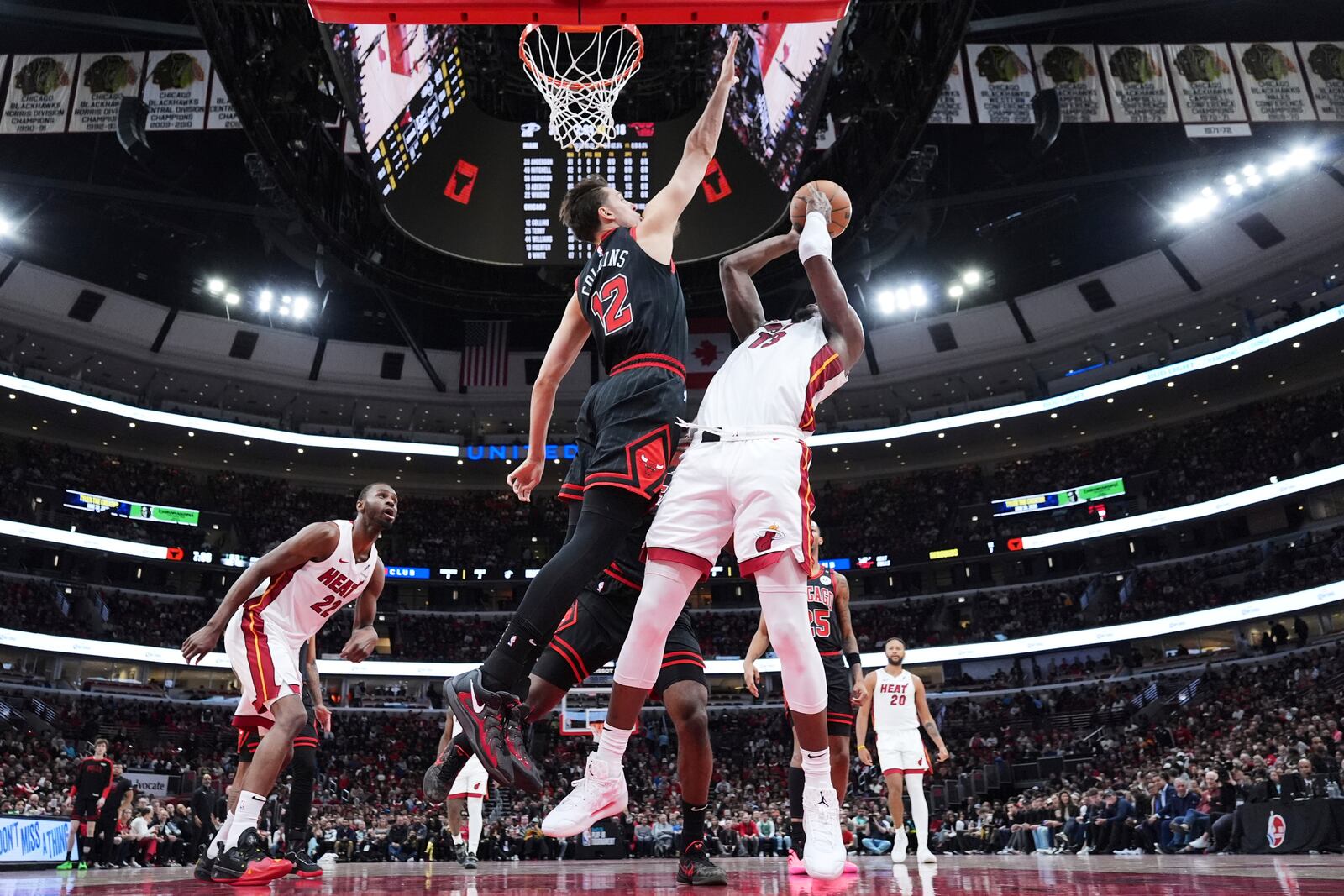 Miami Heat center Bam Adebayo, right, shoots against Chicago Bulls forward Zach Collins during the first half of an NBA play-in tournament basketball game in Chicago, Wednesday, April 16, 2025. (AP Photo/Nam Y. Huh)