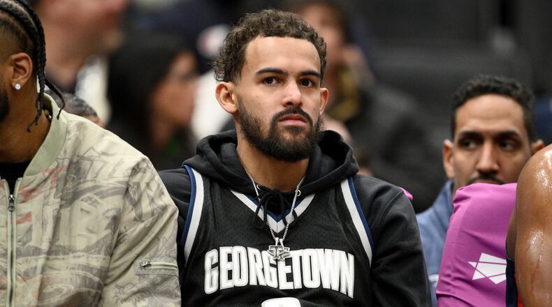 FILE - Washington Wizards guard Trae Young, center, looks on from the bench during the first half of an NBA basketball game against the Los Angeles Clippers, Jan. 19, 2026, in Washington. (AP Photo/Nick Wass, File)